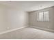 Spacious basement with neutral carpeting and a window with built-in blinds at 3205 Quivas St, Denver, CO 80211