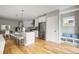 Contemporary kitchen featuring stainless steel appliances and an island with seating at 3205 Quivas St, Denver, CO 80211