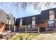 View of multi-unit brick exterior with well maintained lawn and trees at 5833 S Pearl St, Centennial, CO 80121