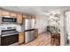 Spacious kitchen with modern appliances, ample cabinet space, and a view to the dining area at 5833 S Pearl St, Centennial, CO 80121