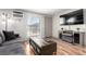 Cozy living room includes a large window and stylish furnishings, creating a relaxing atmosphere at 5833 S Pearl St, Centennial, CO 80121