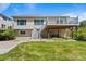 Relaxing backyard with a spacious deck, lush lawn, and mature trees, ideal for outdoor living at 21690 Longs Peak Ln, Parker, CO 80138