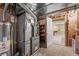 Unfinished basement area with exposed utilities, doorway to another room, and concrete floors at 21690 Longs Peak Ln, Parker, CO 80138