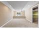 Finished basement featuring natural lighting and neutral colored carpet at 21690 Longs Peak Ln, Parker, CO 80138