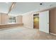 Finished basement featuring natural lighting and neutral colored carpet at 21690 Longs Peak Ln, Parker, CO 80138
