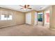 Bedroom boasts natural light from a window and closet with white doors at 21690 Longs Peak Ln, Parker, CO 80138