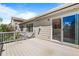 Spacious wooden deck with railing offering outdoor living space at 21690 Longs Peak Ln, Parker, CO 80138