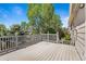 Wooden deck featuring a railing and views of backyard trees at 21690 Longs Peak Ln, Parker, CO 80138