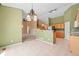 Open dining area featuring tile flooring, decorative lighting, and a view to the kitchen at 21690 Longs Peak Ln, Parker, CO 80138