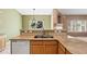 Lovely kitchen with tile floors, stone countertops, and eat-in breakfast bar at 21690 Longs Peak Ln, Parker, CO 80138