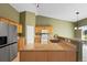 Well-equipped kitchen with stainless steel appliances, tile floors, and stone countertops at 21690 Longs Peak Ln, Parker, CO 80138