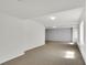 Expansive basement featuring neutral carpet, white walls, recessed lighting, and plenty of open space at 20394 E Colgate Pl, Aurora, CO 80013
