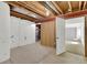 Unfinished basement space with exposed beams and concrete flooring, offering potential for customization at 20394 E Colgate Pl, Aurora, CO 80013