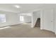 Bright basement space with neutral walls, carpet, and a staircase, ideal for creating a Gathering room, playroom, or additional living area at 20394 E Colgate Pl, Aurora, CO 80013