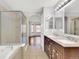 Primary bathroom with double vanity, soaking tub, and walk-in shower at 20394 E Colgate Pl, Aurora, CO 80013