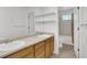 Bright bathroom featuring double sinks, stylish vanity, and a shower-tub combo, perfect for relaxing and refreshing at 20394 E Colgate Pl, Aurora, CO 80013