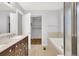 Primary bathroom features a double vanity, bathtub, and a walk-in closet at 20394 E Colgate Pl, Aurora, CO 80013
