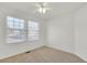 Cozy bedroom featuring neutral walls, plush carpet, and windows that offer ample natural light for a bright and airy feel at 20394 E Colgate Pl, Aurora, CO 80013