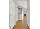 Bright entryway with hardwood floors leading to a living space with fireplace at 20394 E Colgate Pl, Aurora, CO 80013