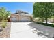 Attractive two-story home with a spacious driveway and lush green lawn at 20394 E Colgate Pl, Aurora, CO 80013