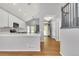 Well-lit kitchen featuring an open layout with stainless steel appliances and hardwood floors at 20394 E Colgate Pl, Aurora, CO 80013