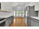 Open kitchen with stainless steel refrigerator and hardwood floors at 20394 E Colgate Pl, Aurora, CO 80013