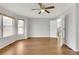 A bright living room is featured with great natural light and hardwood floors at 20394 E Colgate Pl, Aurora, CO 80013