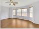 A bright living area with many windows to provide natural light and hardwood flooring at 20394 E Colgate Pl, Aurora, CO 80013