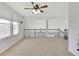 Spacious loft area with neutral walls, carpet, and natural light from windows, ideal for a home office or recreation room at 20394 E Colgate Pl, Aurora, CO 80013