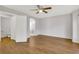 A primary bedroom offers a ceiling fan, great natural light, and an ensuite bathroom at 20394 E Colgate Pl, Aurora, CO 80013
