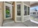 Inviting covered front porch with detailed trim and a convenient entry door at 20394 E Colgate Pl, Aurora, CO 80013