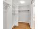 A walk-in closet features built-in shelves at 20394 E Colgate Pl, Aurora, CO 80013