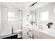 Bathroom with double sinks, walk-in shower, and sleek, modern fixtures at 12555 W 10Th Ave, Golden, CO 80401