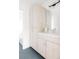 Bathroom featuring modern vanity with gray-wood-grain cabinetry and ample storage space at 12555 W 10Th Ave, Golden, CO 80401