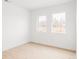 Bright bedroom featuring hardwood floors, dual windows, and a clean, modern aesthetic at 12555 W 10Th Ave, Golden, CO 80401