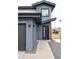 Stylish home entrance with modern door, gravel accents, and contemporary exterior at 12555 W 10Th Ave, Golden, CO 80401