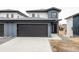 Attractive townhome with a modern design, garage, and inviting entrance at 12555 W 10Th Ave, Golden, CO 80401