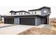 Modern home featuring attached garages, concrete driveways, and contemporary design at 12555 W 10Th Ave, Golden, CO 80401