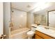 Clean bathroom with a tub, toilet and a vanity with a mirror at 1885 S Quebec Way # 16, Denver, CO 80231