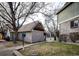 Private garage with adjacent landscaping and walkway at 1885 S Quebec Way # 16, Denver, CO 80231