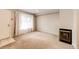 Living room featuring a fireplace and carpeted floor at 1885 S Quebec Way # 16, Denver, CO 80231