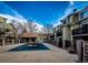 Community pool and patio area with surrounding townhomes at 1885 S Quebec Way # 16, Denver, CO 80231