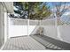 View of wood back deck with a white lattice surround and view of the trees at 12638 James Pt, Broomfield, CO 80020