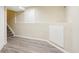Basement area with vinyl floors, stairway and white accents at 12638 James Pt, Broomfield, CO 80020