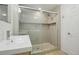 Bathroom featuring modern sink, glass shower, tile floor, and tiled shower at 12638 James Pt, Broomfield, CO 80020