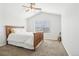 Bright bedroom with a large window and vaulted ceilings, featuring carpet flooring at 12638 James Pt, Broomfield, CO 80020