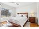 Bedroom featuring a large window, wood floors and neutral walls at 12638 James Pt, Broomfield, CO 80020