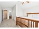 Spacious bedroom with carpet flooring, a ceiling fan, and ensuite bathroom at 12638 James Pt, Broomfield, CO 80020