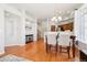 Open-concept dining area that features hardwood floors, natural light, and open space at 12638 James Pt, Broomfield, CO 80020