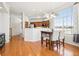 Eat-in kitchen featuring hardwood floors, natural light, and direct access to the kitchen at 12638 James Pt, Broomfield, CO 80020